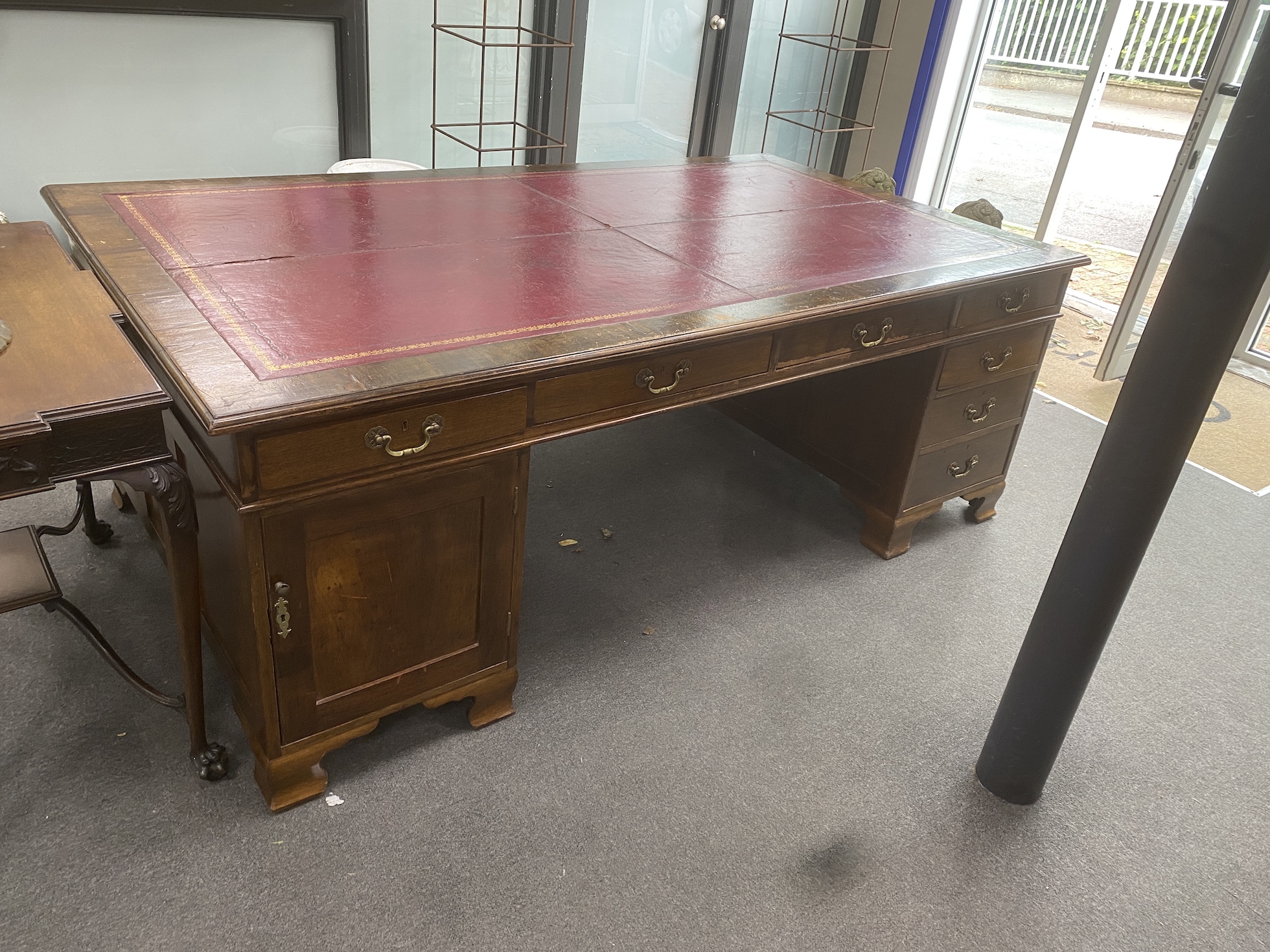A large 1920's George III mahogany pedestal partner's desk, two drawers Phillip, Bristol, length 214cm, width 120cm, height 78cm